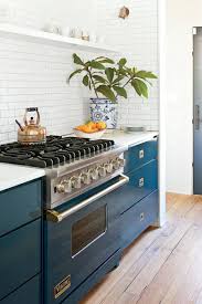 This Unexpected Kitchen Cabinet Color Is Suddenly Everywhere Teal Kitchen Cabinets Kitchen Design Trends Kitchen Design