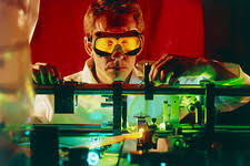 Researcher with dye laser in NIST-7 atomic clock