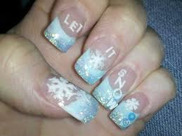 Baby Blue Nails With Snowflakes Pale purple nail polish we love the combination of the colors and the random snowfall.