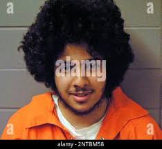 In this undated photo, 16-year-old Chris Carswell holds the long string of  beads that represent the many facets of his lifelong medical journey, in  Brunswick, Ga. Carswell has suffered from debilitating medical