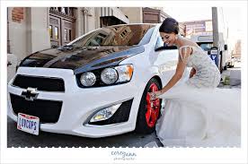 Bride Cleaning Wheel Of Racecar With Her Wedding Dress Wedding Car Themed Wedding Dream Wedding