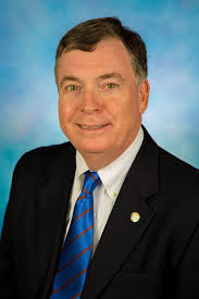 Commissioner Robert F. Stuart Biography