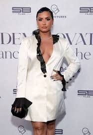 American singer demi lovato has released seven studio albums, two video albums, two soundtrack albums, five extended plays (eps), 44 singles (including 13 as a featured artist), 11 promotional singles and 44 music videos.as of october 2017, they have sold 20.8 million songs and 3.5 million albums in the united states. Demi Lovato Opens Up About Reality Of Coming Out As Nonbinary