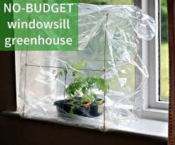 Make Your Own Super Cheap Windowsill Greenhouse The Diy Life Indoor Greenhouse Homemade Greenhouse Diy Greenhouse