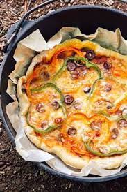 Dutch Oven Pizza Fresh Off The Grid Recipe Healthy Camping Food Camping Food Dutch Oven Pizza