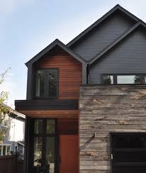 Clad almost entirely in cedar shingles, the house will weather. Modern House Wood Accent Novocom Top