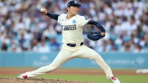 Yoshinobu Yamamoto preparing to pitch for the Los Angeles Dodgers against the Milwaukee Brewers