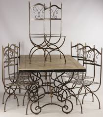 Whether you prefer a metal, glass or wood dining room table you'll find it in a square, round or rectangular shape that perfectly fits your dining space. Table And 8 Wrought Iron Chairs Dinner Tables
