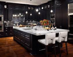 A black accented kitchen not only elevates the space to a whole new level of refinement, but keeps things continually modern and invitingly cosmopolitan. Another Example Of The Superior Work We Can Do For You At Roark Remodeling Modern Black Kitchen Interior Design Kitchen Home Kitchens