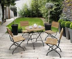 A brown and white stripped vinyl seat cushion is included for each chair. Bistro Round Table And 4 Chairs Patio Outdoor Bistro Dining Set