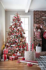These extras can include bows, strands of popcorn and cranberries, and candy canes. Red And White Christmas Tree Plus Christmas Tree Decorating Ideas