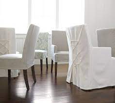 Classic, slipcovered sofas are covered with a handsome shade of navy blue linen. Napa Chair Slipcovers Potterybarn Slipcovers For Chairs Dining Chair Slipcovers High Back Dining Chairs