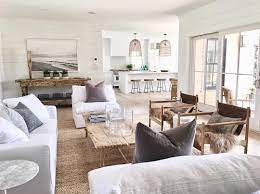 The armchair is african, and the barcelona stools are by mies van der rohe. If It S California Coastal Comfort You Re Looking For This Is It Take A Large Dose Of White Coastal Living Rooms Farm House Living Room Beach House Interior