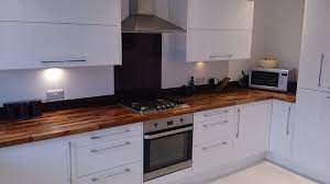 We also have a wide range of splash panels and flooring which. Walnut Worktops Look Excellent Alongside Modern Glossy White Kitchen Units White Kitchen Rustic White Kitchen Units Kitchen Room Design