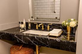 Interior of an empty and luxurious modern bathroom, nobody inside. Black Countertops Vanity Tops