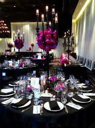 Purple can serve as the primary color, and make bright accents in the overall design of the wedding. Black And White Decor With Red And Purple Flowers Black Wedding Decorations Wedding Centerpieces Wedding Decorations