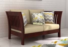 Get the best deals on wooden living room dining chairs. Buy Raiden 2 Seater Wooden Sofa Online In Mahogany Finish To Get An Awesome Furniture Unit Which Provides C Wooden Sofa Designs Wooden Sofa Modern Sofa Designs