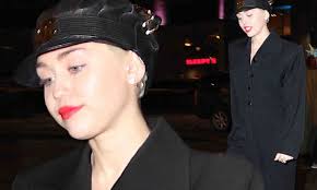 Miley Cyrus opts for conservative black jumpsuit at NYC benefit concert