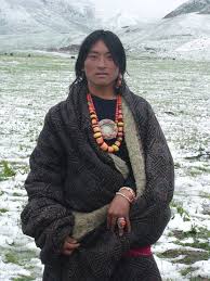 wearing traditional Tibetan jewelry ...