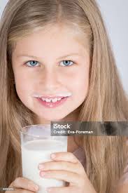 Girl Drinking Glass Of Milk Stock Photo