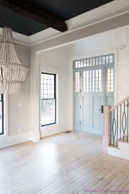 If you partner alabaster with near neutrals from the same yellow hue family, you have to be super careful about managing the chroma. Foyer White Walls Blue Front Foor Uncertain Grey Stardew Alabaster Sherwin Williams Iron Baluster Staircase Whitewashed Hardwood Floors 2 Of 5 Addison S Wonderland