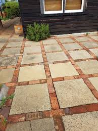This Is A Very Simple And Inexpensive Solution To A Patio Walkway Etc Cement Square Pavers Edged With B Reclaimed Brick Patio Brick Patios Stone Garden Paths