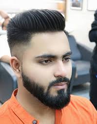 The high fade creates an abundance of negative space from the side, which contrasts well with the thick beard. 20 Devastatingly Cool Haircuts For Men With Thick Hair