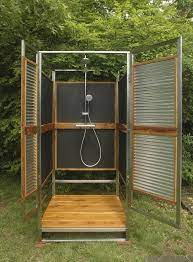 There are two ways to do this: The Sleekest And Simplest Outdoor Shower Of The Season Outdoor Shower Enclosure Outdoor Bathrooms Outdoor Pool Decor
