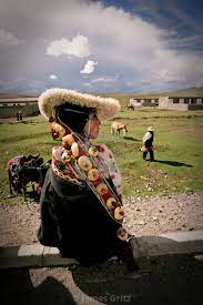 Khampa woman in traditional clothing, Nangchen, Tibet - License, download  or print for £27.00 | Photos | Picfair