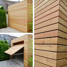 Holzgarage Aus Larche Wir Liefern Ihnen Standardmassig In Ihrem Wunschdesign Garagen Und Carports Mit Bauantrag Holzgarage Haus Und Garten Moderne Garagentore