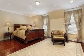 Picket house furnishings brinley cherry king storage 6pc bedroom set cn350kb6pc. Master Bedroom In Luxury Home With Cherry Wood Flooring Stock Photo Picture And Royalty Free Image Image 8792941