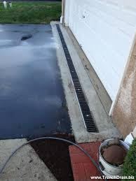 Connect the lengths as you go along, they will slot into the next one at the end. Trench Drain Installation For The Residential Driveway Trenchdrainblog Com Backyard Drainage Yard Drainage Downspout Drainage Ideas Diy
