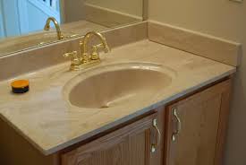 When you see the term integrated used in reference to a vanity top, it means the sink basin is already incorporated into the vanity top—either because it is molded into the countertop material itself (known as a fused sink), or is attached below the vanity top at the factory. Remodelaholic Painted Bathroom Sink And Countertop Makeover