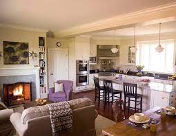 This house gracefully blends the kitchen and the living room through the strategic placement of a round dining table in between that serves as a buffer zone. So Cozy Open Floor Plan Open Concept Kitchen Living Room Living Room And Kitchen Design Open Kitchen And Living Room