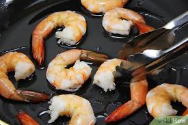 If you cooked the shrimp with the shell on, remove it — but if you're serving for shrimp cocktail, we like to leave the tails on. How To Cook Already Cooked Shrimp 11 Steps With Pictures
