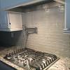Having a kitchen with square tile backsplash combined with wooden kitchen stuff and white kitchen cabinet will give you an impression of an elegant kitchen look. 1