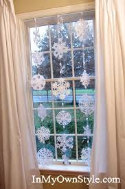 Paint on them, attach paper decorations and stickers right to the glass, hang ornaments. How To Make Paper Snowflakes Into A Window Curtain Snowflake Curtain Christmas Decor Diy Classroom Window Decorations