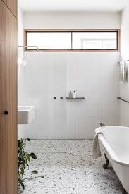 Not only does the terrazzo add dimension to the smaller bathroom, but by using the same pattern throughout the space, thanks to these teeny tiny tiles all the way into the shower, the room appears even larger. Best 12 Modern Bathroom Wall Lighting Terrazzo Floors Design Photos Dwell