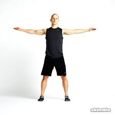 Stand with your back against a wall. Rotating Toe Touches Exercise How To Workout Trainer By Skimble