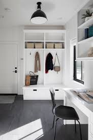 These tips and inspiration photos will help you create a beautiful monochrome mudroom, for a black and white entry way that is welcoming and fresh. Mudroom Storage Utility Room Black Flooring White Cabinets Built In Desk Lakeside Development