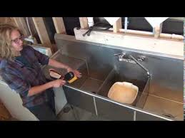 sanitize a three compartment sink