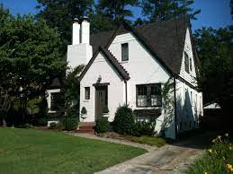 This house in austin had yellow trim and siding as well as a very. Pretty Old Houses House Colors Painted Brick With Dark Trim Painted Brick House Painted White Brick House Brick House Designs
