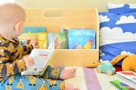 We made this children's book rack by adding a bar on each shelf, so that the books can be displayed facing front. Tidy Montessori Bookshelf Ideas Discount Code How We Montessori