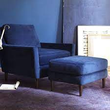 The chair features squared arms that curve down towards the lace tufted back and cushion. Everett Ottoman