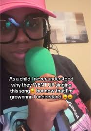 Black Woman Singing Jesus Is King