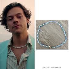 However, once the superstar ripped off his furry accessory, he revealed a second neck accessory: Harry Styles Fashion Archive Harry In The Golden Music Video October 26 2020