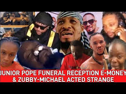 JUNIOR POPE BURIAL RECEPTION + E-MONEY & KCEE, AS ZUBBY-MICHAEL ACTED  STRANGE IN HIS RED T-SHIRT