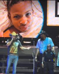 The Bridgestone Arena in Nashville turned into a sea of emotion last night  when country legend Alan Jackson stopped mid-show to invite a young fan,  10-year-old Daniel Carter, onto the stage during