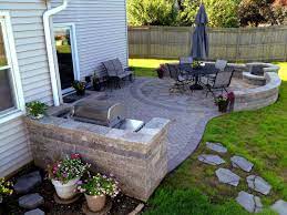 Curved Paver Patio And Outdoor Kitchen Archadeck Outdoor Living Patio Pavers Design Patio Layout Backyard Patio Designs