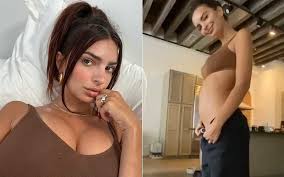 Ratajkowski, who was heavily criticized on social media for the way she held her baby in the photos, also wore a pair of gold hoop earrings and her sylvester necklace. Gone Girl Star Emily Ratajkowski Goes Bold And Bare In Self Shot Pregnancy Reveal Video Flaunts